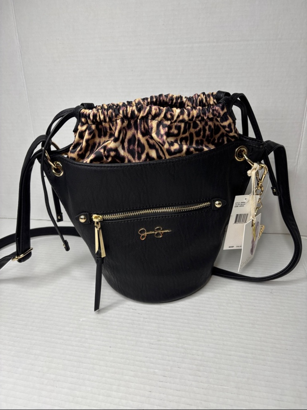 Jessica Simpson black Arden bucket bag with leopard drawstring lining. NWT